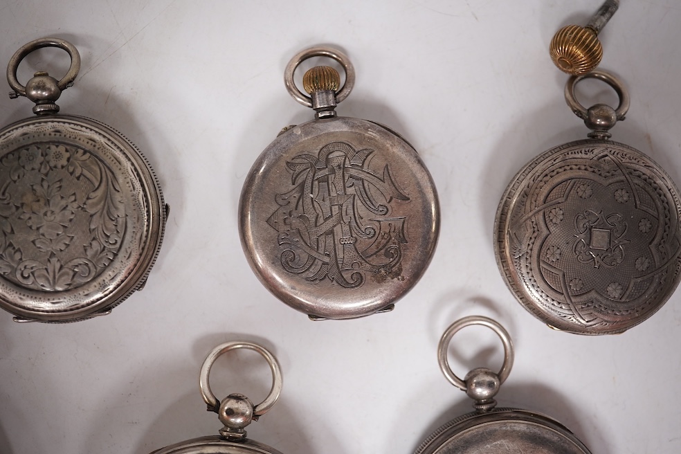 Three early to mid 20th century silver open faced pocket watches, with Roman or Arabic dials and subsidiary seconds, including two keyless and one key wind (Admiral Tacy Watch Co), together with one smaller silver open f